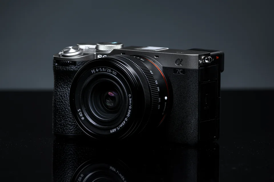 Sony a7C II with an FE 28–60mm lens against a dark studio background