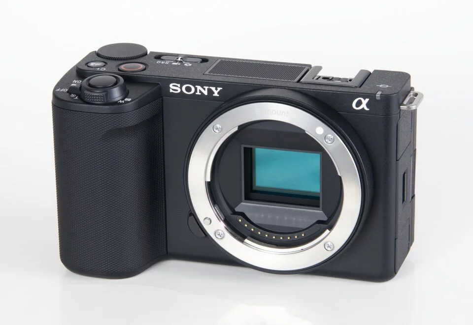 Sony ZV-E10 II camera body with its sensor exposed, photographed from the front at an angle